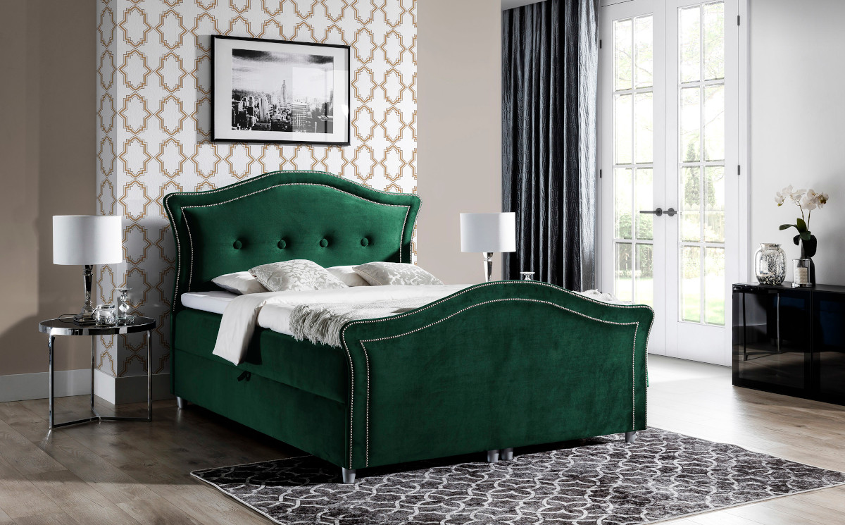 Zielone łóżko kontynentalne z tapicerowanym zagłówkiem i ćwiekami