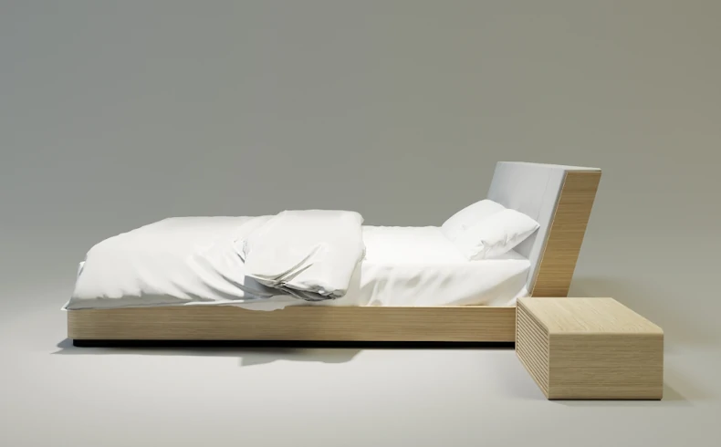 Drewniane łóżko z ukośnym zagłówkiem