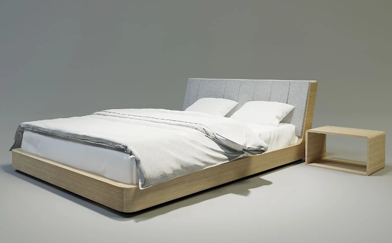 Nowoczesne łóżko z pochylonym tapicerowanym zagłówkiem,