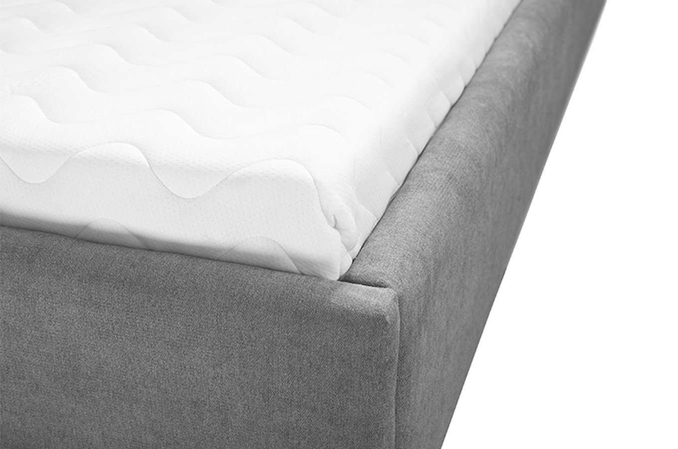 Tapicerowane łóżko do sypialni MALAR z pionowymi przeszyciami na zagłówku.