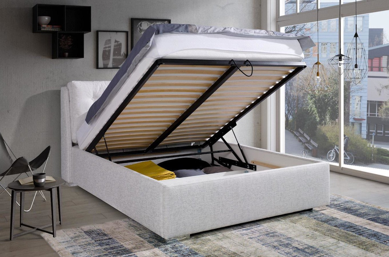 Eleganckie łóżko tapicerowane do sypialni ADRANO z poduszkami na zagłówku